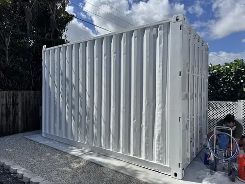 shipping container painted with AMP-UP
